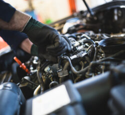 Close,up,hands,of,unrecognizable,mechanic,doing,car,service,and